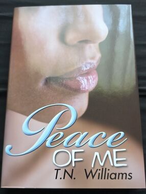 Peace of Me paperback book - soft pink cover with blue title